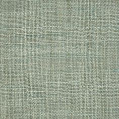 an upholstered fabric textured in light green