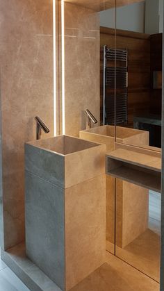 a bathroom with two sinks and mirrors in the wall next to each other on concrete flooring