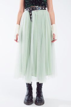 Unveil the magic of elegance with our Green Tulle Midi Skirt, a garment that beautifully combines grace and comfort. Fairy-Tale Inspired Design: This skirt is crafted with layers of soft, flowing tulle, creating an ethereal and romantic silhouette that is both timeless and contemporary. Versatile Midi Length: The skirt's ankle-length cut makes it a versatile piece for various occasions, from casual outings to more formal events. Comfortable Elastic Waistband: Fitted with a high-waist design and Romantic Silhouette, Green Tulle, Tulle Midi Skirt, Simple Tees, Tulle Fabric, Model Fits, Lush Green, Shades Of Green, Fairy Tale