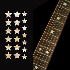 an electric guitar with five stars on it