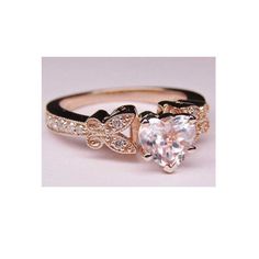 Heart Shape Diamond Butterfly Vintage Engagement Ring In 14k Pink Gold - GIA Certified Center Diamond: Shape: Heart Shape Diamond Carat Weight: 1.03 Carat Color: F - White Colorless Clarity: SI1 Depth:57% Table: 62% Measurements: 5.97 x 7.09 x 4.04 mm Cut grade: Very Good Polish: Excellent Symmetry: Very Good Certified byGIA # 2207114958 Stock number: SNG2 Side Diamonds: Shape: Round Brilliant Cut Diamonds Number of Stones: 14 Total Carat Weight: 0.16 ct. Color, Clarity: G-H(White), Eye Clean(SI Luxury 14k Gold Heart Ring With Vs Clarity, Elegant 14k Gold Butterfly Ring For Anniversary, Luxury Heart Cut Gia Certified Jewelry, Luxury Gia Certified Heart Cut Jewelry, Classic Heart Diamond Ring In Rose Gold, Luxury Heart-shaped Diamond Ring With Vs Clarity, Classic Rose Gold Heart Diamond Ring, Gia Certified Fine Heart Shaped Jewelry, Fine Jewelry Heart-shaped Gia Certified