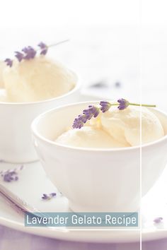 two white bowls filled with ice cream and lavender sprigs