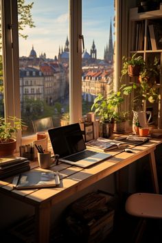 an open laptop computer sitting on top of a wooden desk in front of a window