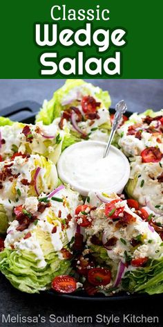 lettuce salad with dressing in the middle on a black plate and green background