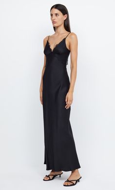 The effortless and elevated Emery Lace Maxi Dress features a v neck with under bust seam and lace detailing. The bias cut dress features adjustable Rouleau straps that lead around to an open back with e-hook hardware and a soft cowl drape. Dress is finished with a raw edged hem. Styled with our Jasmine Kitten Heel. Sheer Black Bridesmaid Dress, Black Satin Floor Length Dress, Black Party Dress Classy, Cowl Drape Dress, Formal Dresses Black, Party Dress Classy, Baddie Vibes, Maxi Dres, Prom Inspo