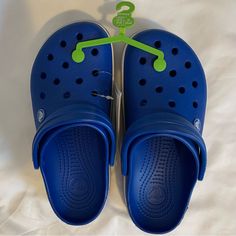 Crocs Crocband Clog Color: Blue Bolt Size: M6|W8 Casual Blue Clogs For Spring, Blue Beach Clogs With Cushioned Footbed, Blue Synthetic Clogs For Summer, Casual Blue Closed Toe Clogs, Synthetic Blue Clogs For Summer, Casual Adjustable Blue Sandals, Casual Blue Adjustable Sandals, Comfortable Blue Clogs With Round Toe, Blue Synthetic Clogs With Cushioned Footbed