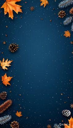 autumn leaves and pine cones on a dark blue background with space for text or image