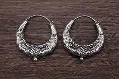 Ethnic Nepali solid pure Silver Earring-Tribal Jewelry- Ethnic Jewelry- Nepal 20th c A rare pair of small size solid pure silver earring. It has a simple design with two snakeheads. These well-made earrings are worn by women of various tribal groups for centuries. Oxidize silver, in good condition. Wt: 4g Origin: Nepal 20th c Traditional Round Engraved Earrings, Traditional Engraved Round Earrings, Handmade Traditional Earrings For Rituals, Traditional Oxidized Finish Earrings For Ceremonial Occasions, Traditional Oxidized Hoop Earrings For Gift, Traditional Silver Hoop Earrings As Gift, Traditional Silver Hoop Earrings For Gift, Traditional Engraved Round Hoop Earrings, Traditional Engraved Hoop Earrings Gift