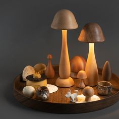 an assortment of mushrooms on a wooden tray