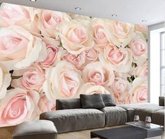 a living room filled with furniture and flowers on the wall