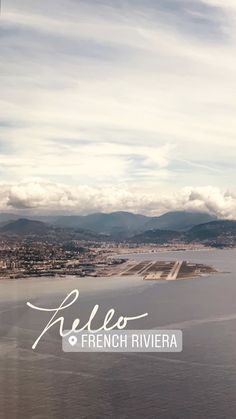 an aerial view of the water and mountains in french riviera, as seen from a plane