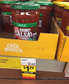 jars of chili sauce are on display in a grocery store's shelf for $ 1 99 each