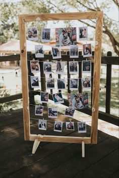 a wooden frame with pictures hanging on it