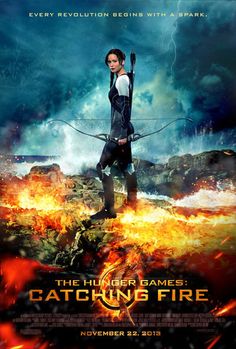 the movie poster for the film catching fire with an image of a woman holding a bow