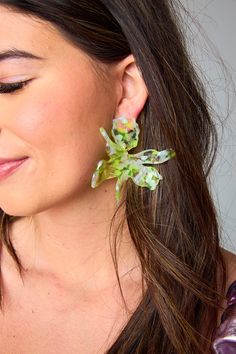 At BuddyLove, we LOVE an accessory so Grayson designed the ultimate statement earrings to make accessorizing your BuddyLove pieces easier than ever! These bright citron tropical earrings will have you ready for a vacation! This item is FINAL SALE. Chic Green Jewelry For Spring, Chic Green Spring Jewelry, Chic Green Earrings For Gift, Yellow Earrings For Spring Vacation, Green Earrings For Summer Gift, Playful Green Earrings For Summer, Lime Green Earrings For Gift, Playful Green Summer Jewelry, Summer Green Playful Jewelry