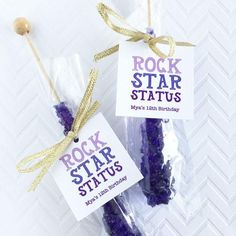 two rockstark sticks are wrapped in cellophane and tied with twine