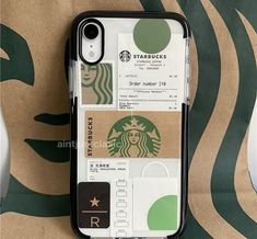 an iphone case with starbucks stickers on it