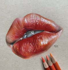 a pencil drawing of a woman's lips with two orange crayons next to it