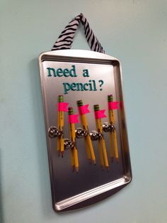 a sign that says need a pencil? with four yellow pencils in the middle