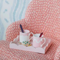 Designed to sit beautifully on any bedside table, coffee table, or sideboard this pretty, pale pink lacquer tray boasts a playful scalloped edge and deep straight sides. A must-have for any home this piece functions wonderfully as a vanity tray, drinks tray, or for displaying small trinkets.DESIGN DETAILS- Cream velvet base with embossed logo- Finished with 20 coats of high gloss lacquer- Hand polished between each coat of lacquerDIMENSIONS: 11 in. x 8 in.CARE- Arrives beautifully packaged and ready to gift- Wipe clean with a soft damp cloth as needed Pink And Gold Bathroom Tray, Preppy Bed Tray, Addison Ross, Elegant Dinner Party, Small Vanity, Drinks Tray, Leather Frames, Small Tray, Happy Birthday Balloons