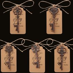 six key tags tied with twine and string, each containing an antique style key