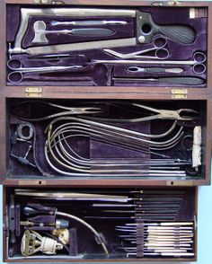 two wooden boxes filled with different types of scissors and other tools in it's compartments