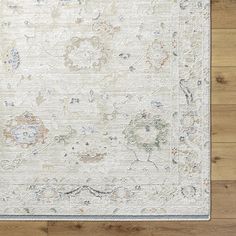 a white rug with floral designs on it