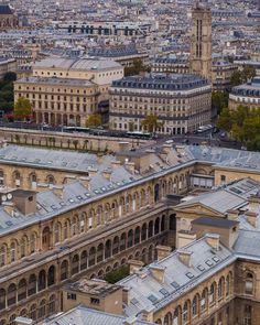 an aerial view of the city with many buildings and spires in paris, france