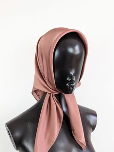 Dusky pink satin headscarf Luxury modern bohemian satin headscarf. This is made from a soft synthetic blend satin fabric. The fabric is luxurious and lightweight. This scarf is versatile and can be worn in many ways around the neck or head. It is large enough to be tied around the head to give full coverage, or to be draped around the neck.  This is a square scarf that can be folded to create the triangle look, or wrapped up and tied in a knot to be worn as a headband. Style: Head scarf Measurements:  Width: 28 inches (71 cm)  Length: 28 inches (71 cm)   Fabric: Non stretch satin  Colour: Pink Chic Pink Satin Silk Scarf, Pink Satin Scarf For Summer, Elegant Pink Satin Scarves, Elegant Pink Satin Scarf, Elegant Pink Bandana, Pink Headband Scarf For Spring, Pink Headband-style Headscarf For Spring, Adjustable Pink Headscarf For Spring, Pink Headband Headscarf For Spring