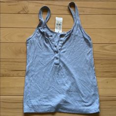 Blue Button Up Tank New And In Perfect Condition, Super Soft And Comfy. One Size But Fits Like A Xs-S Button Up Tank Top, Blue Buttoned Tops For Day Out, Everyday Blue Tops With Buttons, Light Blue Everyday Tops With Buttons, Everyday Light Blue Tops With Buttons, Summer Blue Cami Tank Top, Summer Button-up Tank Top, Blue Cotton Buttoned Tank Top, Fitted Blue Tank Top With Button Closure