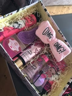 an open box filled with different types of beauty and hygiene products on top of a table