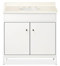 a white cabinet with two doors and a counter top on the bottom, against a white background