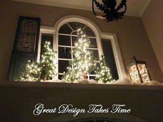 a christmas tree is lit up in front of a window with the words great design takes time