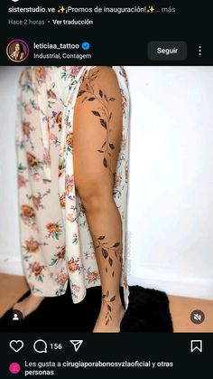 a person with tattoos on their legs and leggings