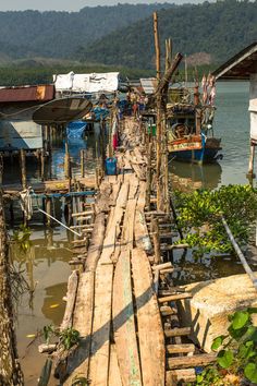 a long wooden bridge over a body of water