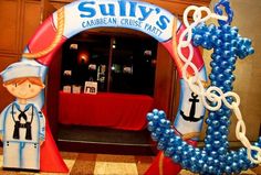 the entrance to sully's caribbean cruise party is decorated in blue and white