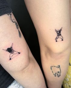 two people with tattoos on their arms