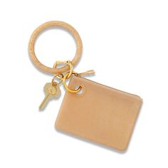 a keychain with a leather case and two keys hanging from it's side