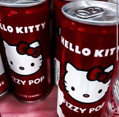 hello kitty sodas are lined up on the shelf