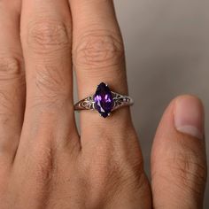 This is a gorgeous handmade creation. Its beauty is its simplicity & Elegance. The 6*12 mm marquise shape faceted natural amethyst is crafted in solid sterling silver and with rhodium plated. Main stone weight about 1.67 ct. All item is sent in a beautiful gift box If you have any idea of design your ring,pls contact me directly. You can realize more lovely stuff clicking the link https://www.etsy.com/shop/knightjewelry?refshopsection_shophome_leftnav Please leave the correct address and you Elegant Marquise Solitaire Birthstone Ring, Sterling Silver Marquise Ring With Center Stone, Classic Marquise Jewelry With Accent Stones, Marquise Gemstone Jewelry For Anniversary, Elegant Gemstone Ring Marquise Cut, Elegant Silver Marquise Birthstone Ring, Marquise Diamond Ring Gift, Marquise Cut Birthstone Jewelry For Anniversary, Elegant Marquise Crystal Ring With Gemstone