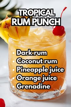 the tropical rum punch is served in a glass with pineapple juice and garnish