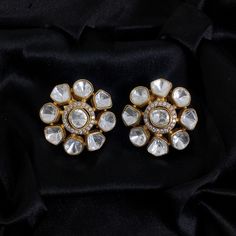 Inspired by Sabyasachi, the Polki Earrings with Kundan Studs feature Uncut Diamond Jadau craftsmanship. These Big India Stud Earrings are a Premium Statement for weddings and Bollywood glamour. They blend traditional elegance with contemporary style, making them a luxurious and meaningful gift for any special occasion. *𝐏𝐑𝐎𝐃𝐔𝐂𝐓 𝐃𝐄𝐓𝐀𝐈𝐋* * Material: Brass * Plating: Gold Plated * Stone: Semi Precious Kundan & Polki *𝐃𝐈𝐌𝐄𝐍𝐒𝐈𝐎𝐍𝐒* * Weight: 8 gm Each, Diameter: 1.1 Inches (Push White Festive Earrings For Formal Occasions, Festive White Earrings For Formal Occasions, Heavy Kundan Earrings For Anniversary, Traditional White Bridal Earrings For Formal Occasions, Traditional White Bridal Earrings For Formal Events, White Stone Work Earrings For Formal Occasions, Elegant Party Earrings With Gota Work, Traditional White Diamond Earrings For Formal Occasions, Traditional White Earrings For Formal Occasions