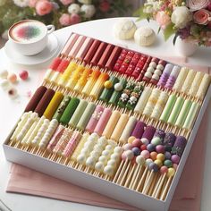 a box filled with lots of different colored matches