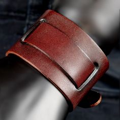 This sturdy leather bracelet is the savvy style move you need. The cross-over double straps make a bold, modern statement and make you feel put together and ready to take on anything. The durable leather construction can withstand your active lifestyle while still looking sharp. Specifications: Material: Leather & Stainless SteelColor/Design: VariousSize: AdjustableWidth: 1.4" | 3.8cm - 1.97" | 5cm BERML invites you to lace your wrist in old soul spirit with a leather cuff bracelet. More than mere jewelry, this is wrist armor worn by history's boldest. Ancient tribal chiefs flaunted their hunting prowess. Medieval kings commanded battalions clad in leather. Hardcore punks and goths stated their individualism. Leather cuff bracelets are all about the most daring, the most influential. Is it Pearl Choker Necklace, Naha, Leather Cuffs Bracelet, Pearl Choker, Botswana, Angkor, Leather Cuffs, Granada, Haiti