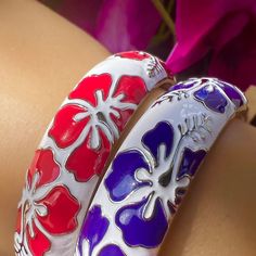 We added more colors to our popular Puanani Hibiscus Bangle. Everybody loves purple, so we had to add it to the collection. These beautiful bracelets are our own design so you won’t find them anywhere else! Approximately 15MM wide and it’s hinged so you can easily open it and put it on your wrist. Made with a Gold plated base and vibrant enamel colors! All this and it comes in a set of two! 15MM Width 18K gold plated over brass Silver plated over brass Hinged opening Vibrant enamel colors Our ow Purple Bracelet Jewelry For Beach, Purple Bracelet Jewelry For The Beach, Purple Jewelry For Summer Vacation, Purple Bracelet For Summer Gifts, Flower Bangles, Hawaiian Heirloom Jewelry, Weave Extensions, Beautiful Bracelets, Brass Hinges