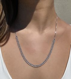 Make a subtle statement with our Curb Chain Link Necklace! We love it paired with a simple T and jeans...yet this style is glam enough to wear out with that perfect little black dress. What do we love about this curb link necklace? It is adjustable! Featured with a slider function, so you can wear it at any desired length. BONUS . . . not only can you wear it with the glitz side up but flip it over and wear it on the all metal side for a casual appearance. Rhodium plated sterling silver Handset Silver Cuban Link Jewelry For Everyday, Everyday Silver Cuban Link Jewelry, Trendy White Gold Link Jewelry, Silver Everyday Curb Chain Jewelry, Silver Curb Chain Jewelry For Everyday, Sterling Silver Curb Chain Necklace For Everyday, Everyday Silver Curb Chain Jewelry, Everyday Sterling Silver Curb Chain Necklace, Trendy Silver Necklace For Everyday