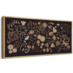 a black and gold floral wall hanging on a white wall with wood trimmings