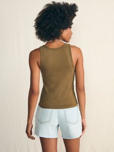 Look no further for the perfect summer tank top. Crafted in organic cotton that has been garment-washed for a lived-in look and feel, it fits like a dream – not too tight, not too loose. Cut in a flattering silhouette, this is the timeless wear-with-everything tank. Some call these basics – we definitely don't. Specifications Fit: Slim fit Detail: Sleeveless ribbed tank. Material: 95% Organic Cotton, 5% Elastane Model: Alissa is 5’9 wearing size Small Care: Turn inside out. Machine Wash cold with like colors. Gentle cycle. Do not bleach. Tumble dry low. Remove promptly. Cool iron when needed. Relaxed Washed Tops For Summer, Everyday Summer Racerback Tops, Everyday Racerback Tops For Summer, Casual Washed Summer Tank Top, Racerback Tops For Everyday Summer Wear, Casual Washed Tank Top For Summer, Summer Washed Muscle Tee With Relaxed Fit, Summer Everyday Washed Tops, Summer Cotton Tank Top