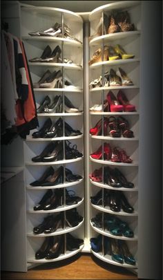 the closet is filled with many pairs of shoes