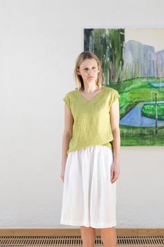 "Oeko-Tex Standard certified 100% pure linen blouse is a summer must have! Simple style makes it perfect for embellishments. Make your wardrobe bloom this season with @LinenCloud! Details: *Colour shown: pear green / white *Model is wearing size M *Medium weight *Relaxed fit *Not-ironed (and no need to) *Handmade by @LinenCloud Easy care: - Machine wash cold - Wash seperately or with similar colours - Do not bleach - Tumble dry low - Non-iron. Simply wash it, hang it, wear it. But if you like it Everyday Relaxed Linen T-shirt, Relaxed Fit Linen V-neck Top, Oversized Linen V-neck Top, Linen V-neck Tops With Ruffles, Relaxed Fit Linen V-neck Tunic, Linen Tank Top, Linen Tank, Summer Blouses, Loose Blouse